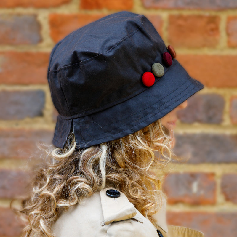 peak and brim zoe black wax hat with side buttons 