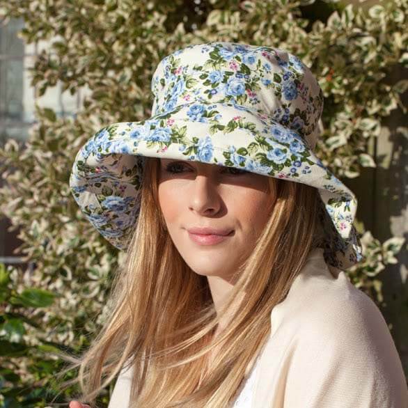 proppa-toppa-louise-blue-floral-sun-hat-on-woman